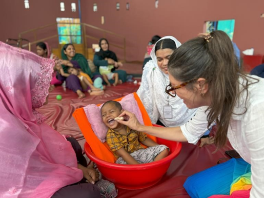 Dr Amanda working with local families during her babiEAT research in Bangladesh 